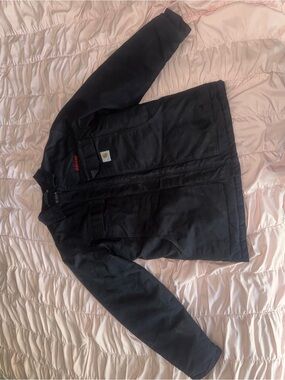 Black Carhartt firm duct insulated traditional coat with red Frito Lay logo